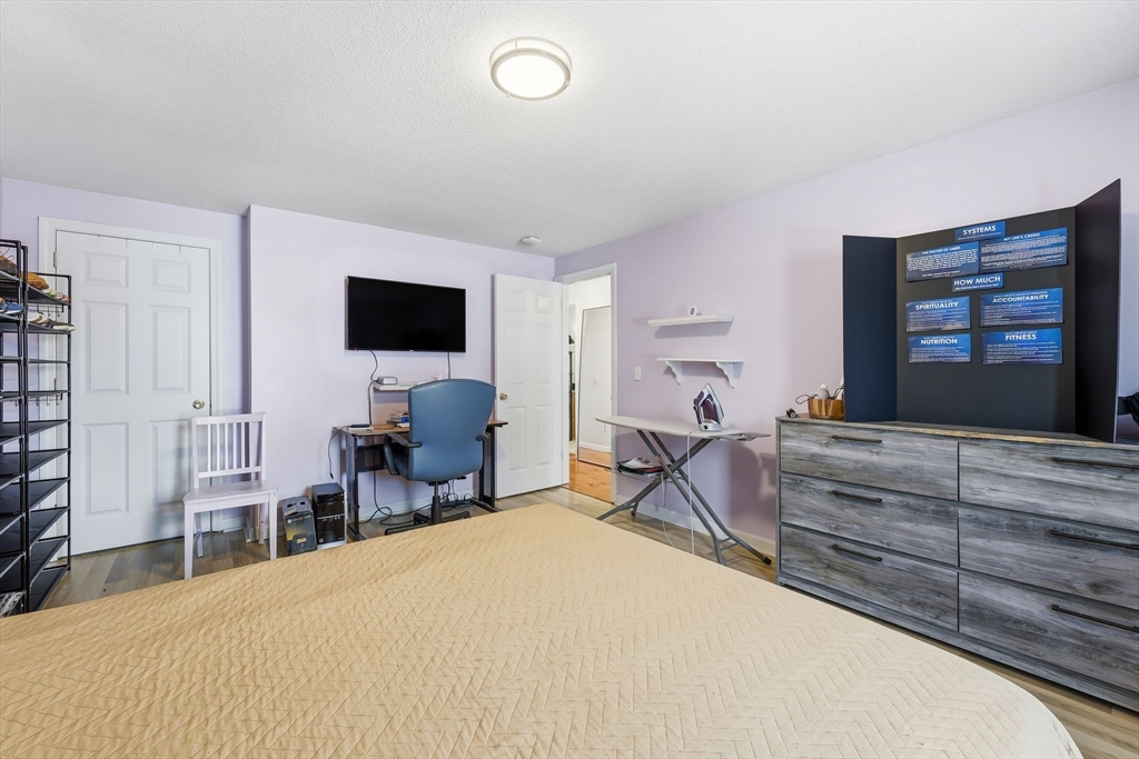 44 Border Street Springfield, MA 01104 - Photo 27 of 36 a bedroom with bed and window