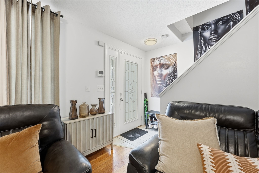 44 Border Street Springfield, MA 01104 - Photo 5 of 36 a living room with furniture and a window