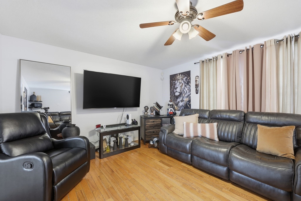 44 Border Street Springfield, MA 01104 - Photo 9 of 36 a living room with furniture and a flat screen tv