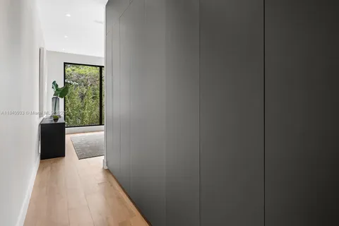a view of hallway with wooden floor