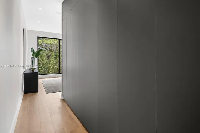 a view of hallway with wooden floor