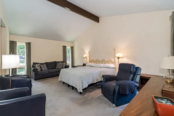a bedroom with furniture and a couch