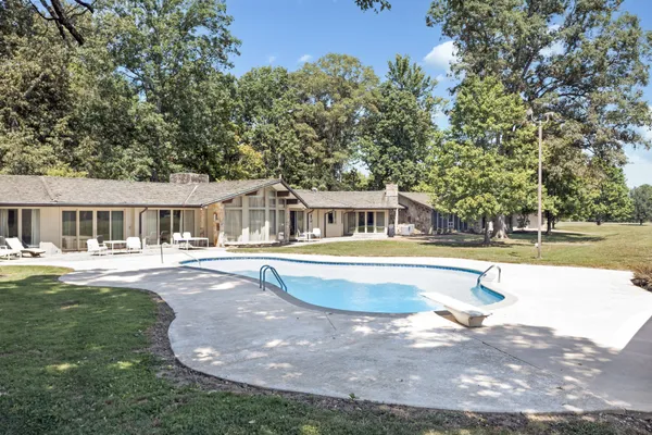 a swimming pool with outdoor view