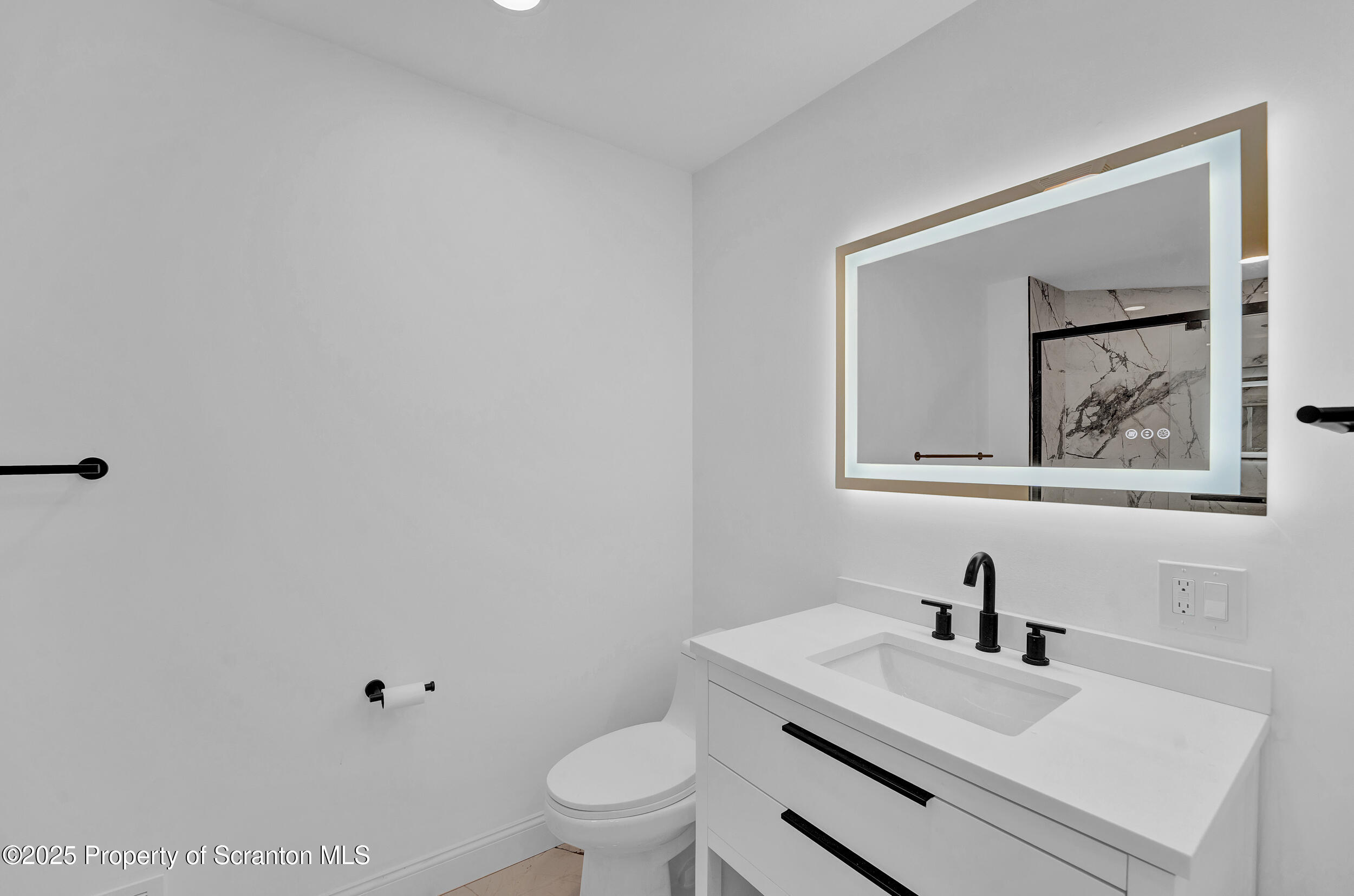 33 Fordham Road Wilkes Barre, PA 18702 - Photo 36 of 93 a bathroom with a toilet sink vanity and mirror