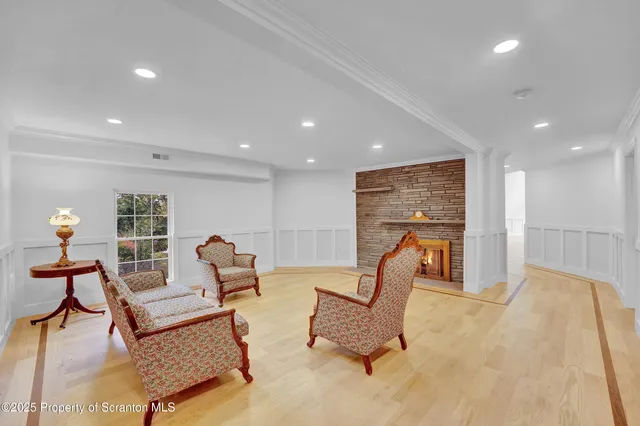 a view of a roof deck with wooden fence and plants