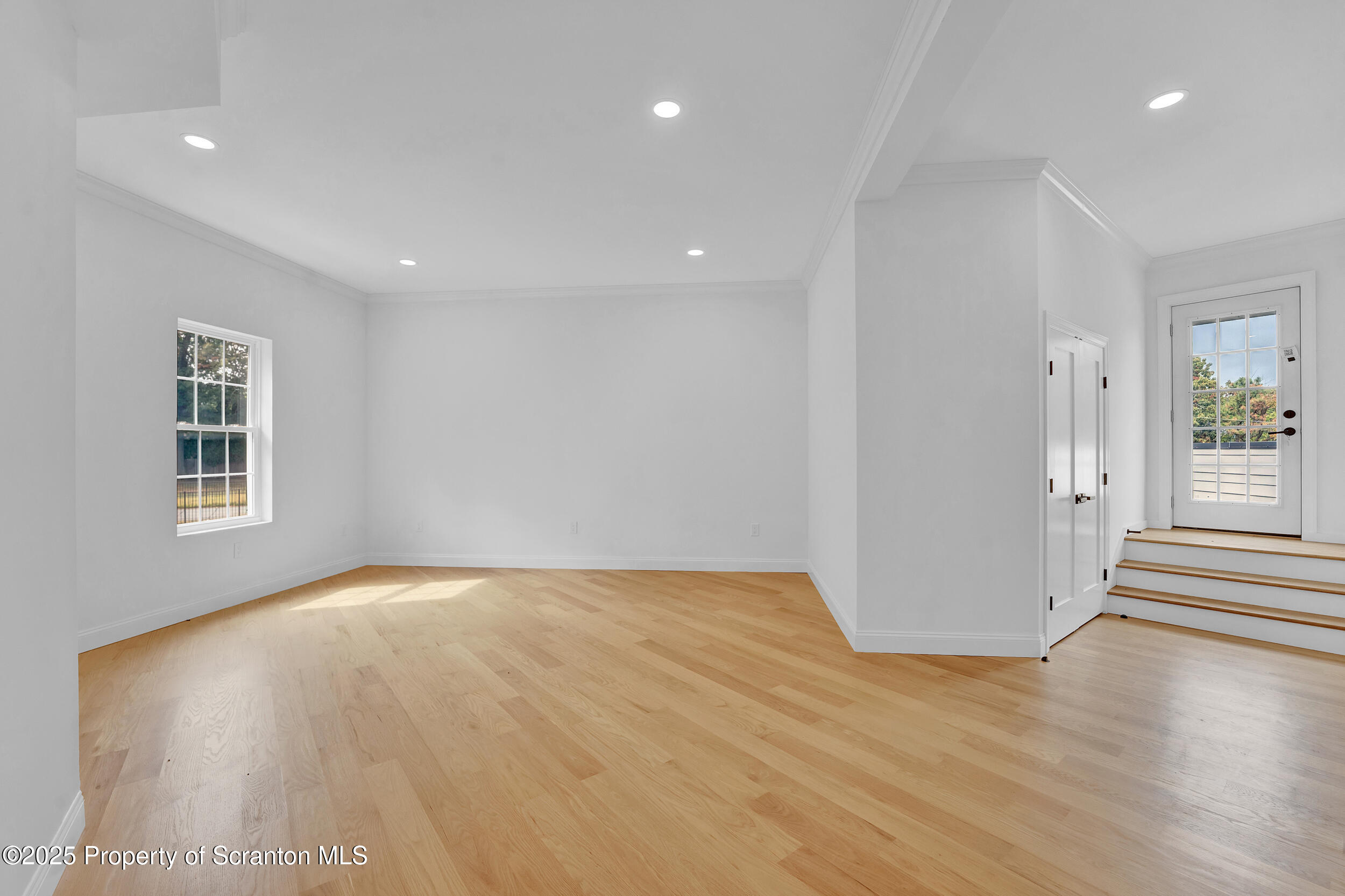 33 Fordham Road Wilkes Barre, PA 18702 - Photo 63 of 84 a view of an empty room with wooden floor and a window