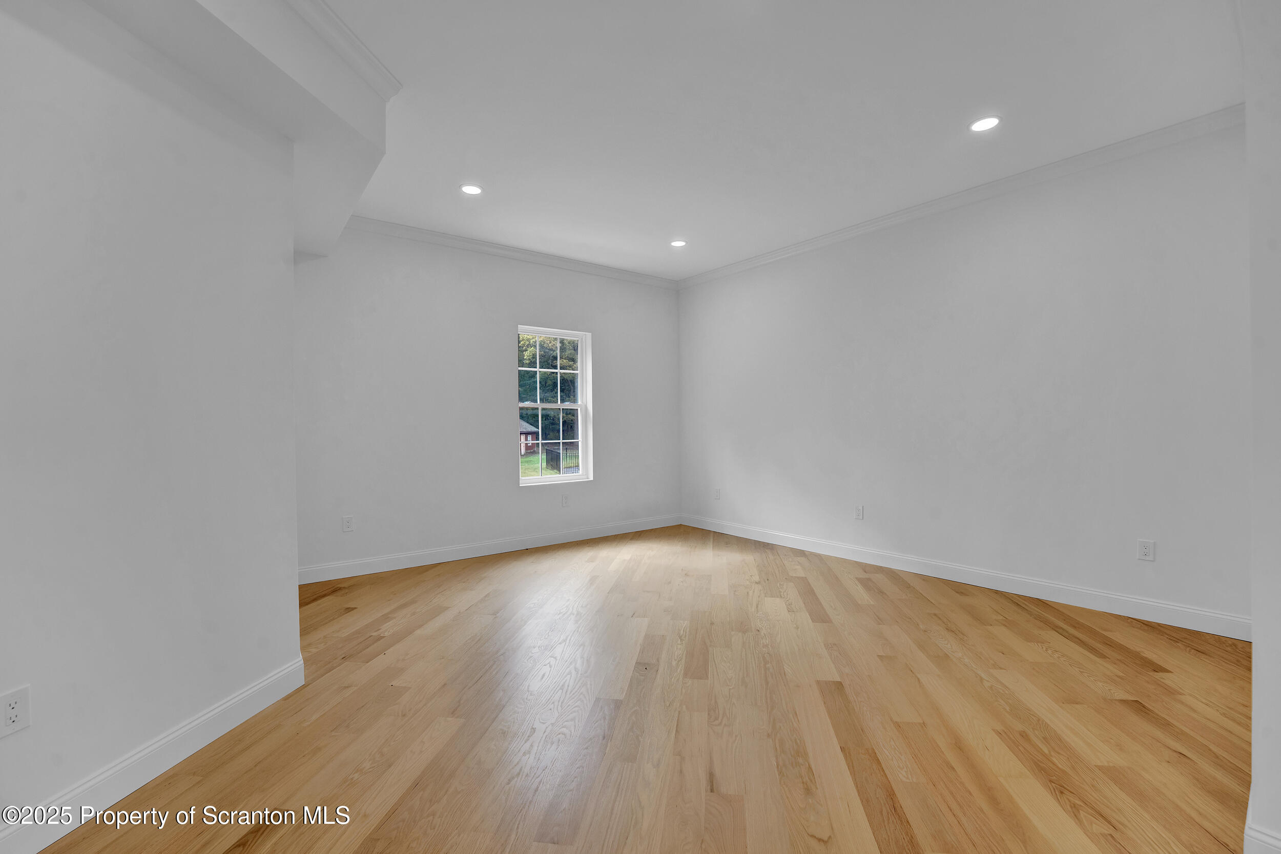 33 Fordham Road Wilkes Barre, PA 18702 - Photo 65 of 84 a view of an empty room with wooden floor and a window