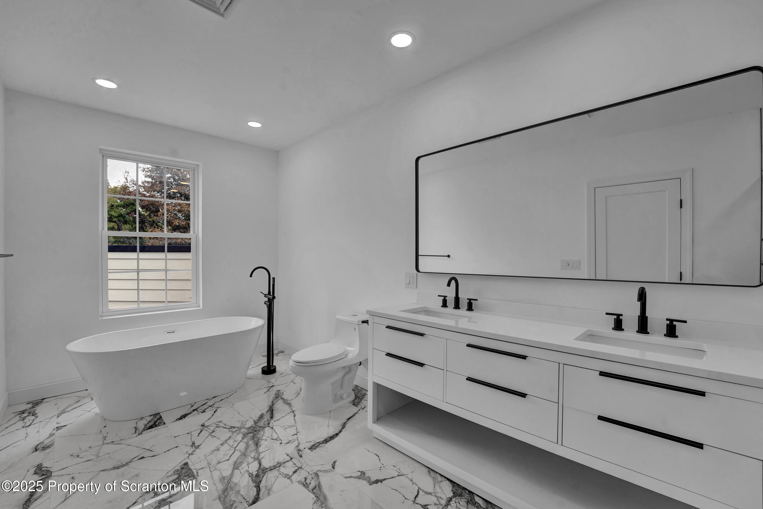 33 Fordham Road Wilkes Barre, PA 18702 - Photo 67 of 84 a bathroom with a double vanity sink mirror and bathtub