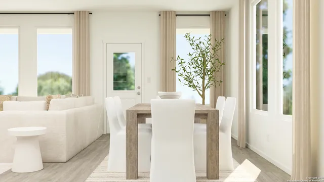 a bathroom with a sink and mirror with bathtub