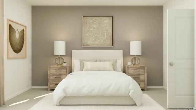 a bedroom with a bed and a night stand