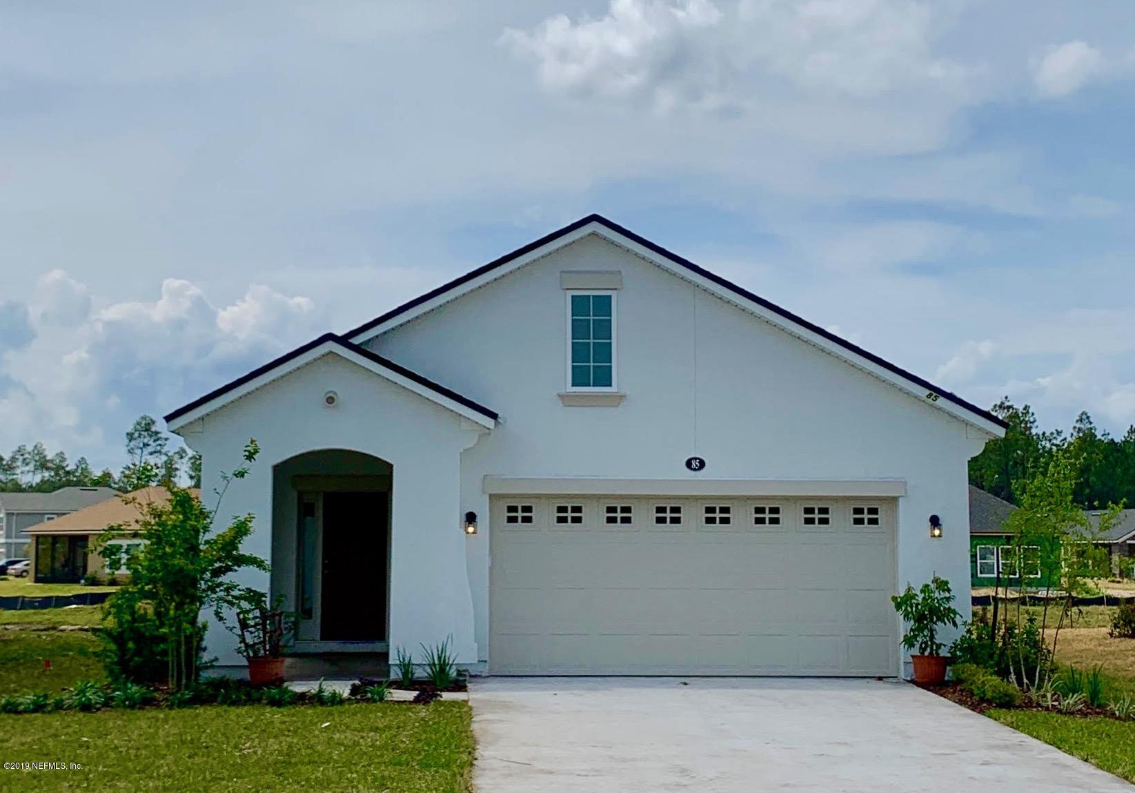 148 Concave Lane St. Augustine, FL 32095 - Photo 1 of 7 a front view of a house with garden