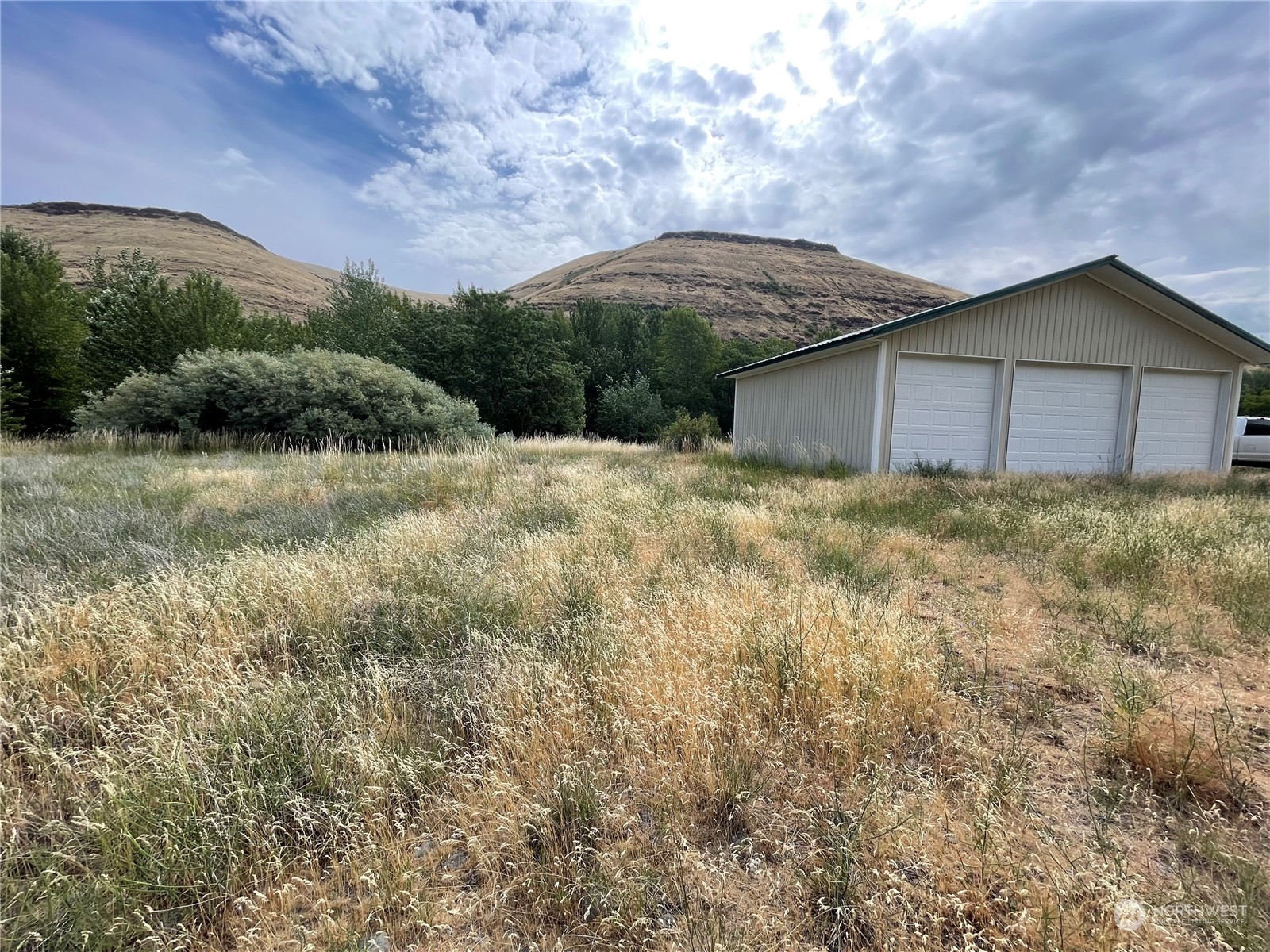 0 Tucannon Road Dayton, WA 99328 - Photo 4 of 7 a view of a yard in front of a house