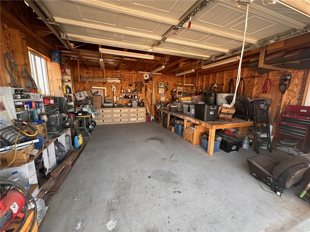 3309 Bacobi Road Golden Valley, AZ 86413 - Photo 25 of 31 Garage featuring a workshop area and wooden walls