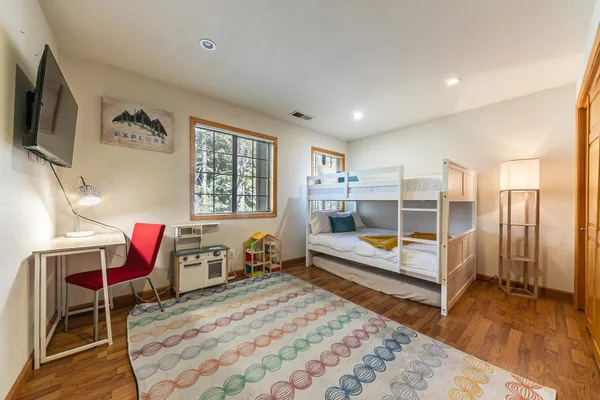 a bedroom with a bed and a table in it