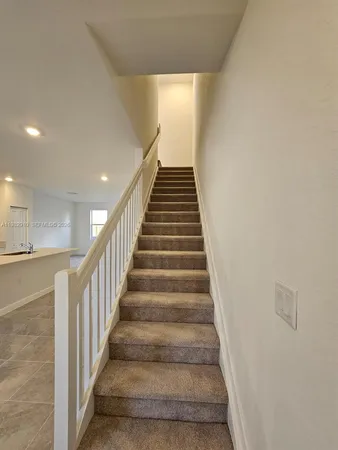 a view of a hallway with staircase