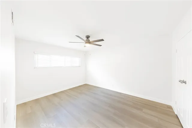 a view of a small space with wooden floor