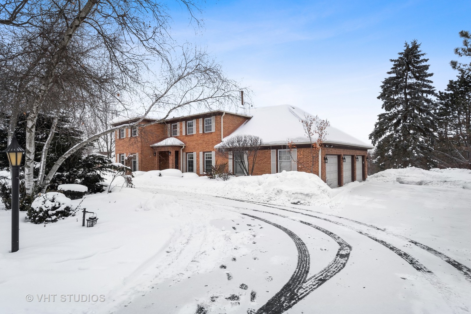1406 Dunheath Drive Inverness, IL 60010 - Photo 2 of 27 a view of a house with snow