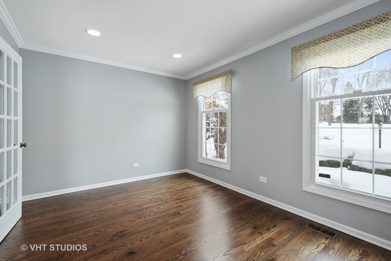 1406 Dunheath Drive Inverness, IL 60010 - Photo 13 of 27 a view of an empty room with a window and wooden floor