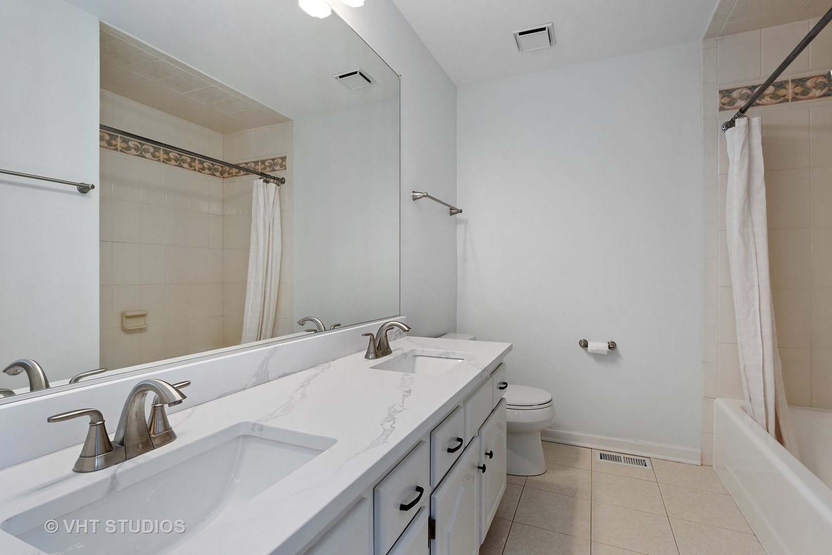 1406 Dunheath Drive Inverness, IL 60010 - Photo 17 of 27 a bathroom with a double vanity sink mirror and toilet