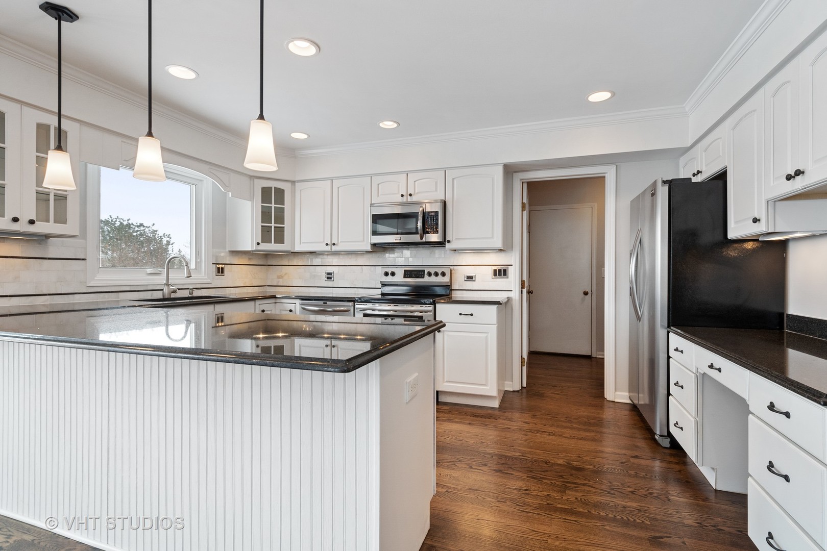 1406 Dunheath Drive Inverness, IL 60010 - Photo 5 of 27 a kitchen with stainless steel appliances a stove a sink a refrigerator and a microwave