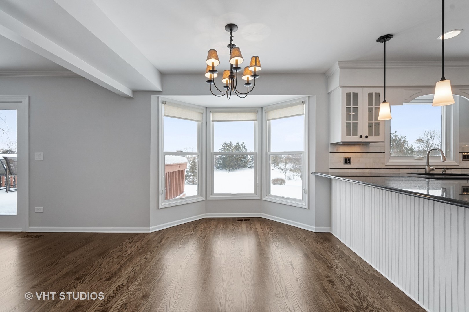 1406 Dunheath Drive Inverness, IL 60010 - Photo 7 of 27 a view of an empty room with a window and wooden floor