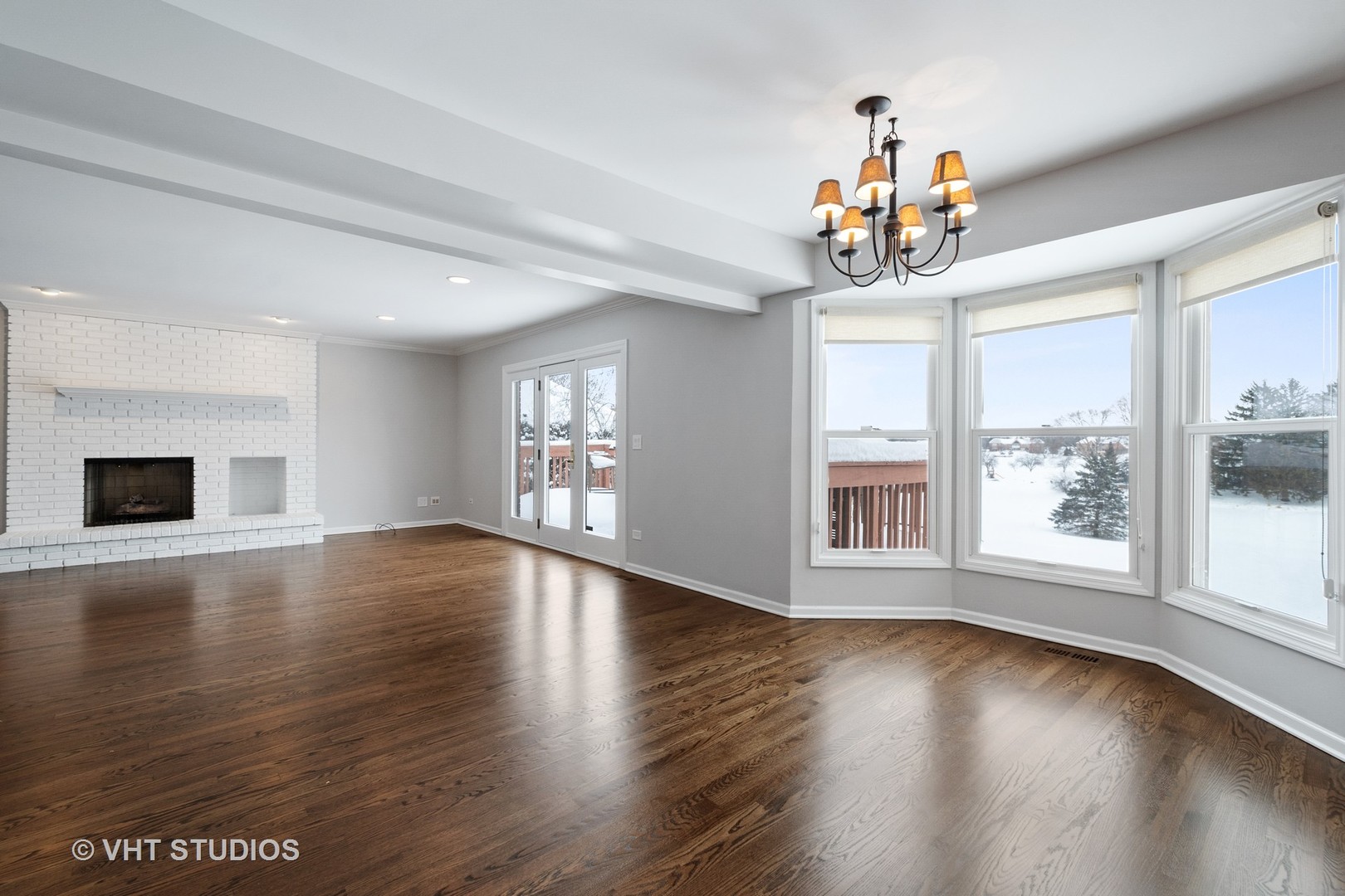 1406 Dunheath Drive Inverness, IL 60010 - Photo 8 of 27 a view of an empty room with wooden floor and a window