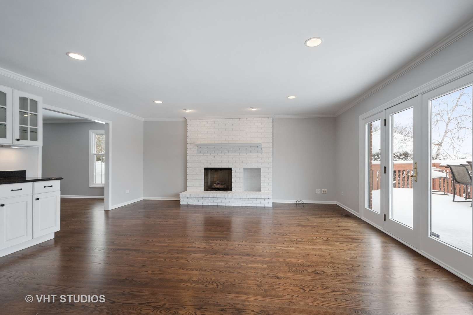 1406 Dunheath Drive Inverness, IL 60010 - Photo 9 of 27 a view of an empty room with wooden floor and a window