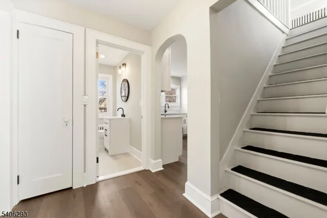 a view of an entryway with wooden floor