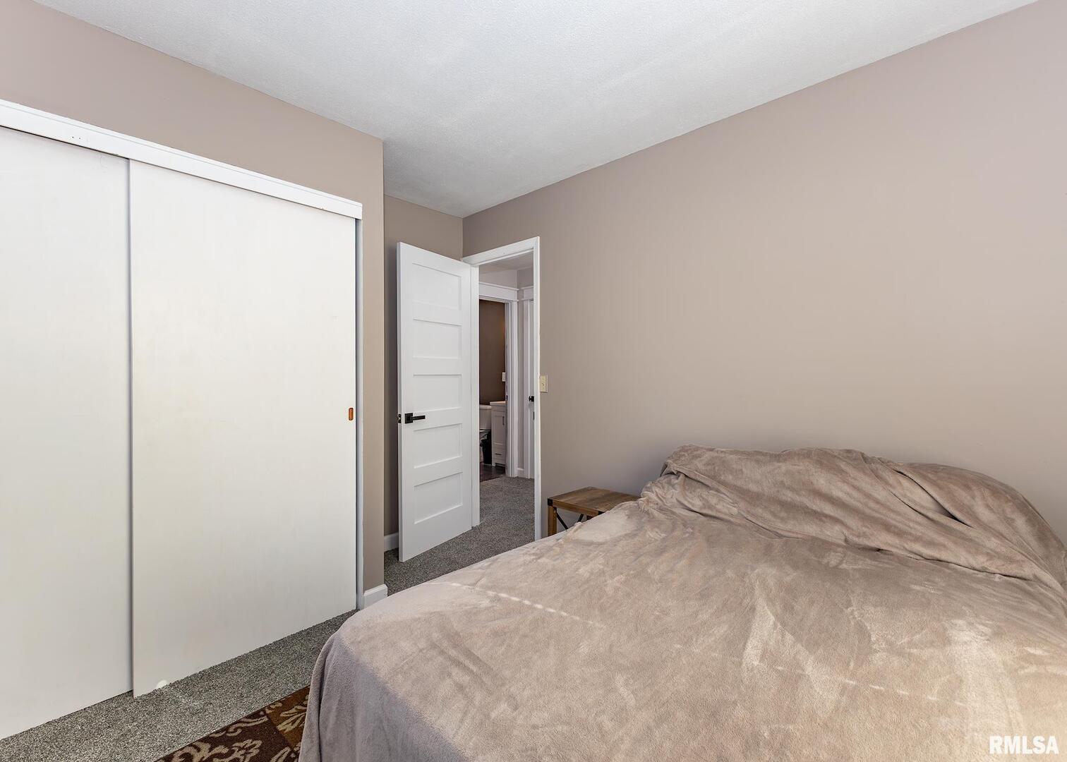 1430 4th Street Camanche, IA 52730 - Photo 12 of 22 a bedroom with a bed and a closet