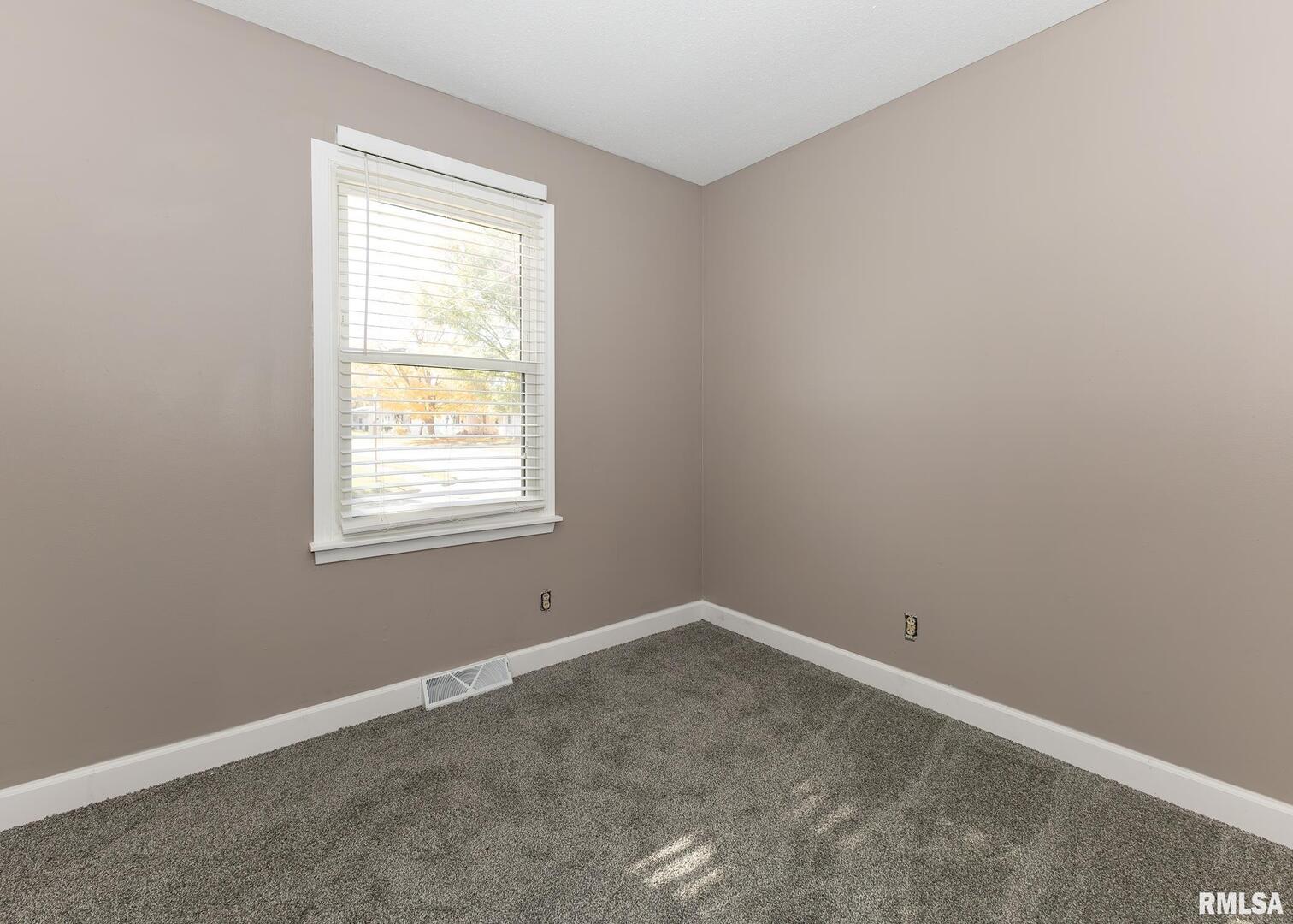 1430 4th Street Camanche, IA 52730 - Photo 16 of 22 an empty room with a window