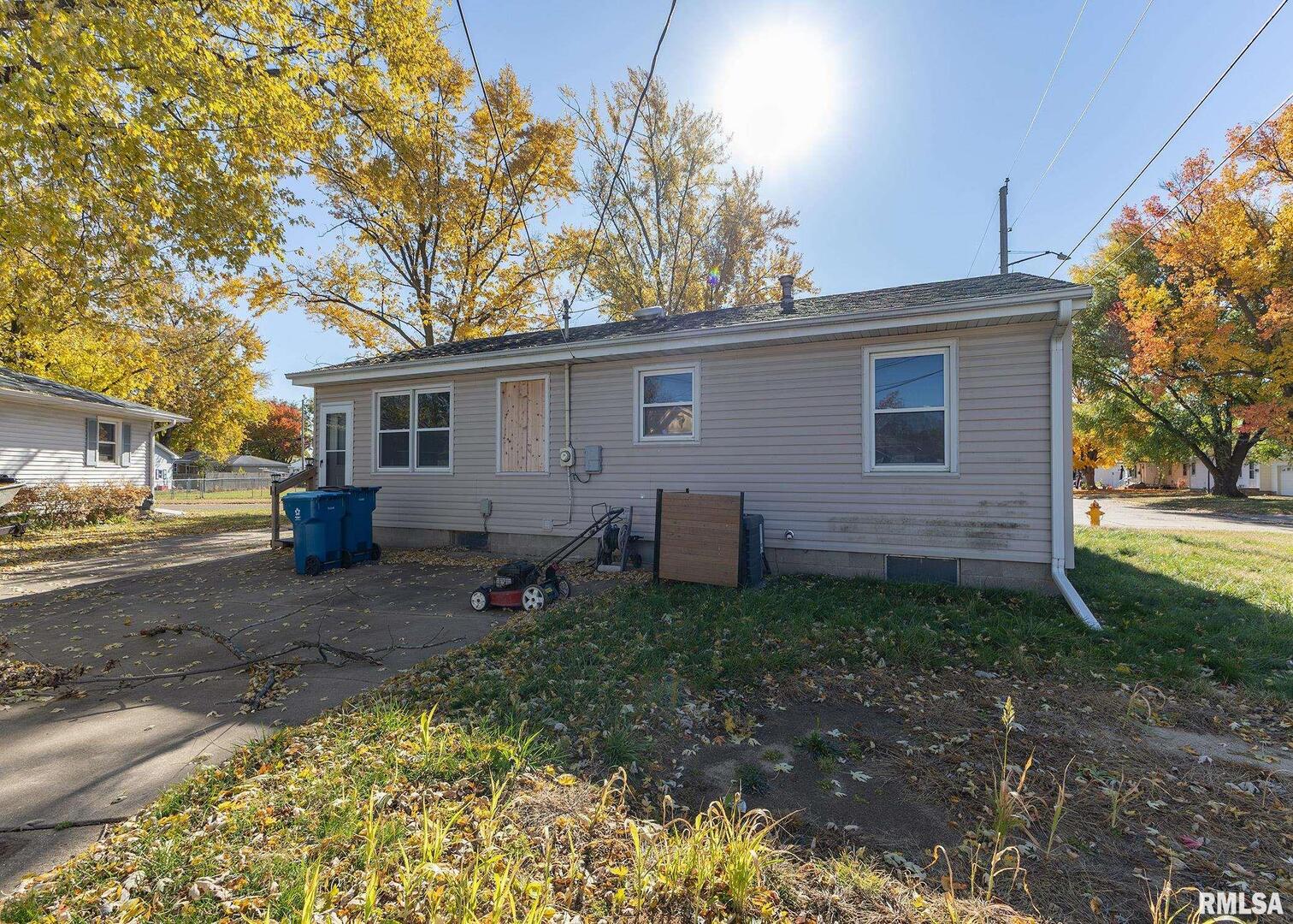 1430 4th Street Camanche, IA 52730 - Photo 22 of 22 a view of a backyard with a large tree