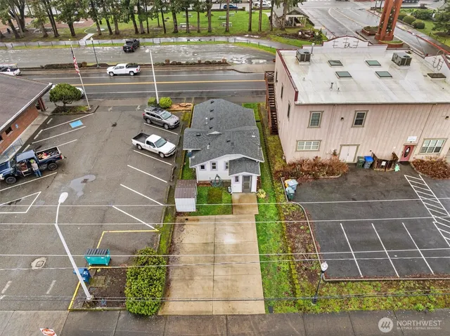 an aerial view of residential houses with city view