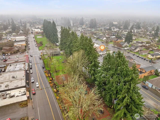 an aerial view of a city with parking