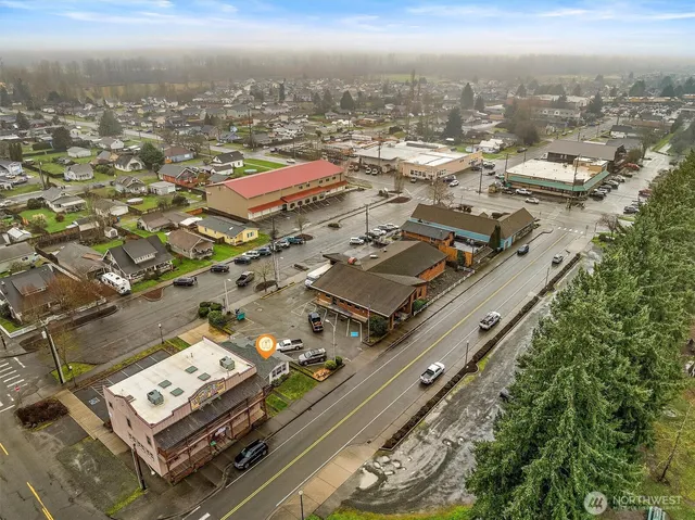 a view of a park with iron fence