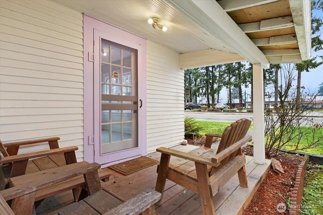 a view of a patio with couches chairs and potted plants