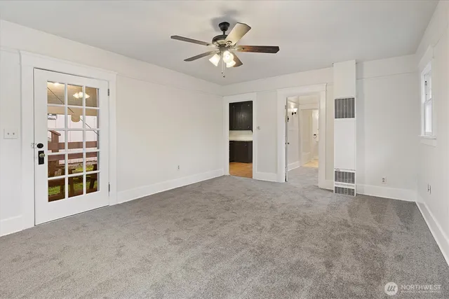 a view of an empty room with a window