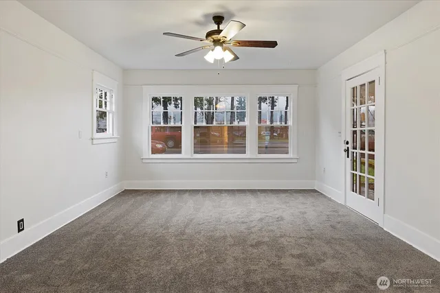 a view of an empty room with a window