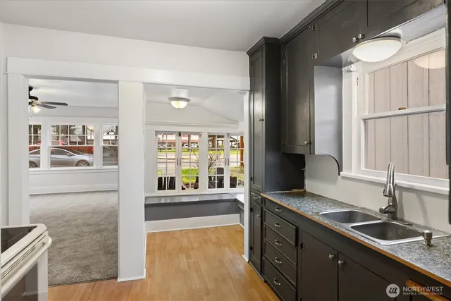 an empty room with windows and closet