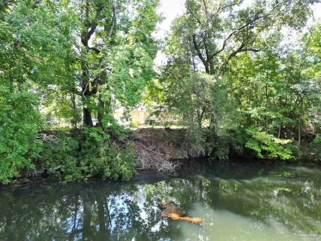 a view of lake with green space