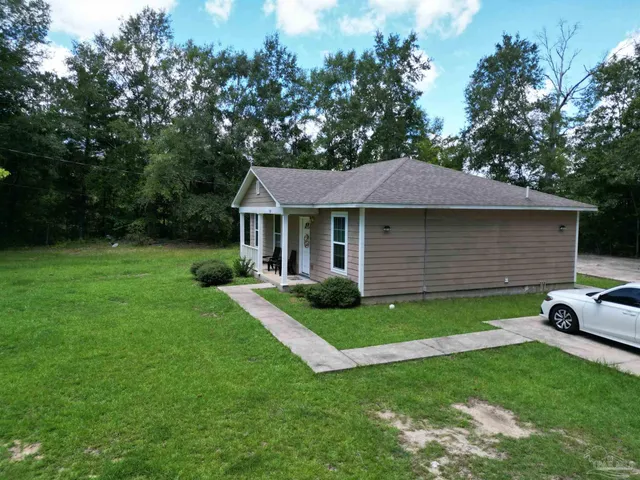 a view of a yard in front of a house