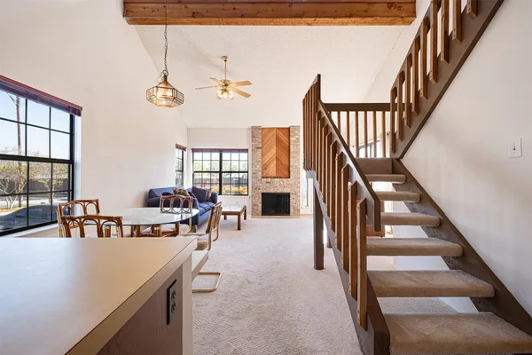 a view of a kitchen from a hallway
