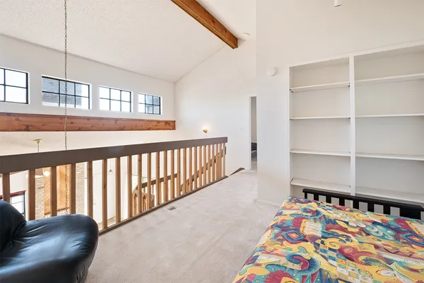 a bedroom with bed and a window