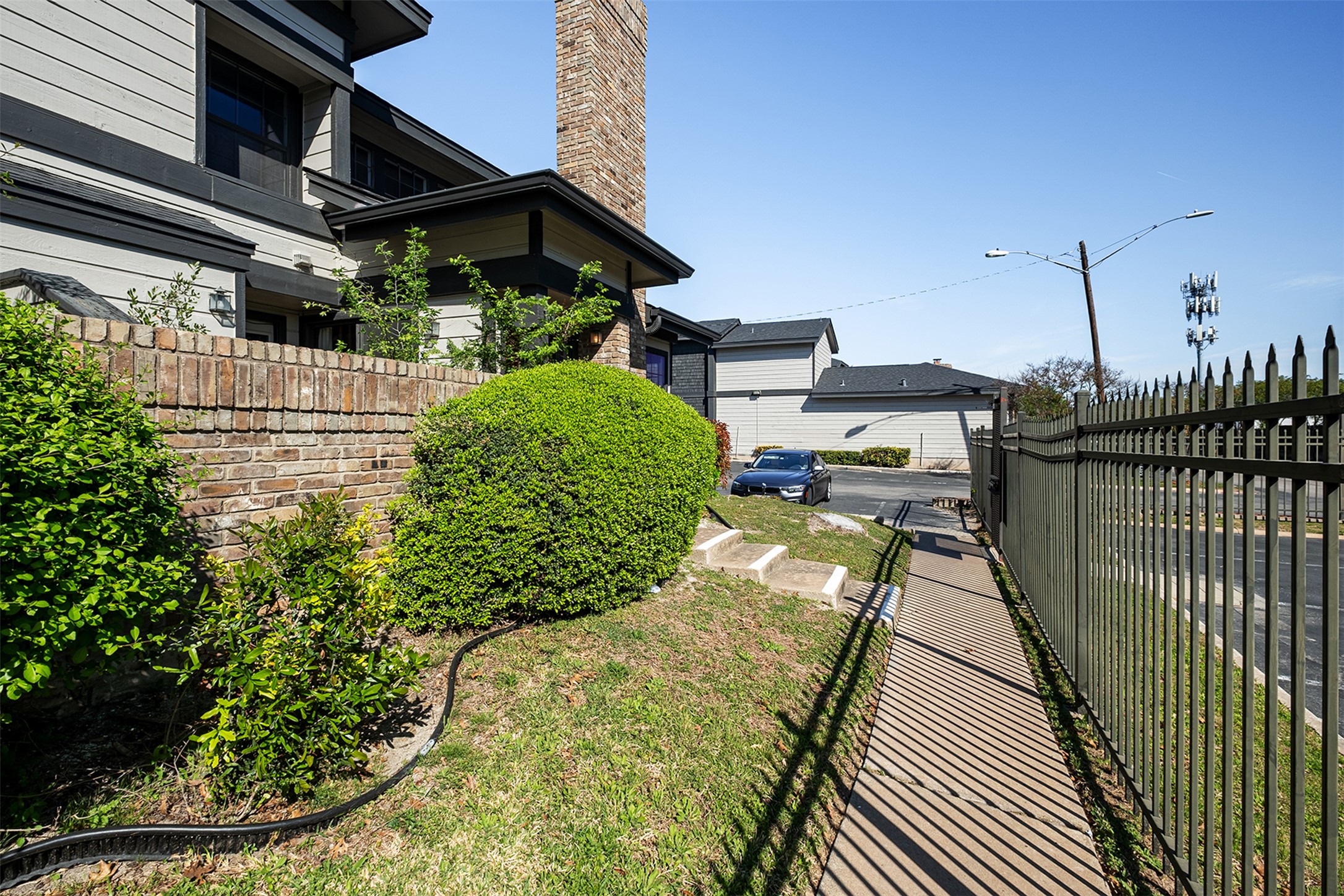 1748 Ohlen Road, Unit 16 Austin, TX 78757 - Photo 3 of 38 a view of a backyard with sitting area
