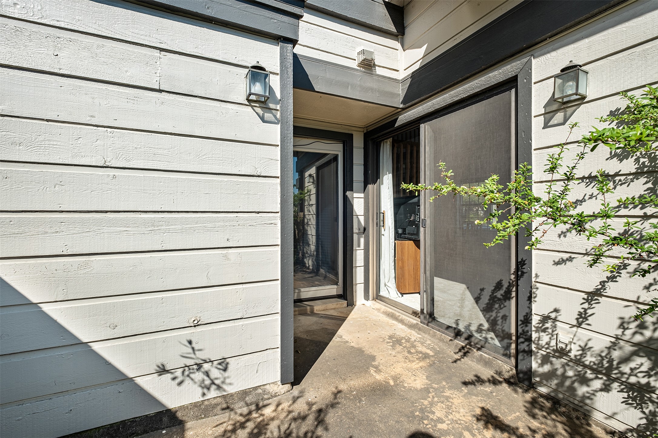 1748 Ohlen Road, Unit 16 Austin, TX 78757 - Photo 33 of 38 a view of a house with a potted plant and a window
