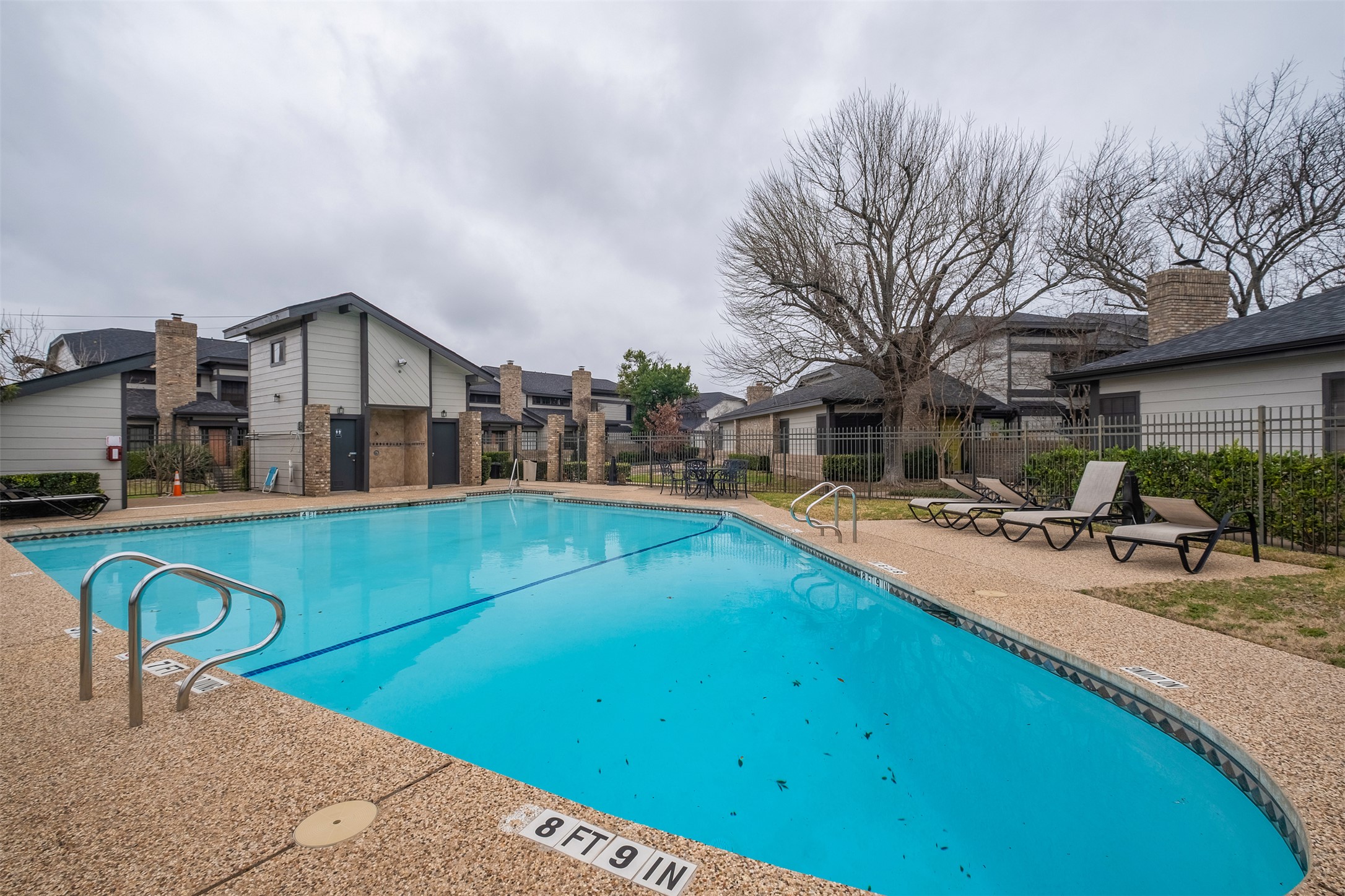 1748 Ohlen Road, Unit 16 Austin, TX 78757 - Photo 36 of 38 a view of a house with pool and chairs