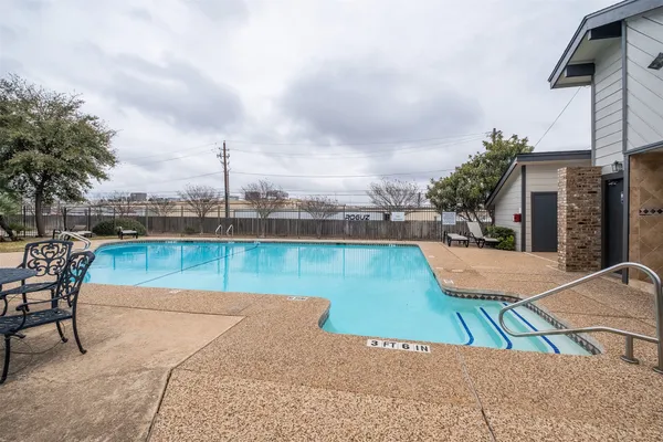 a view of a swimming pool with a lounge chairs