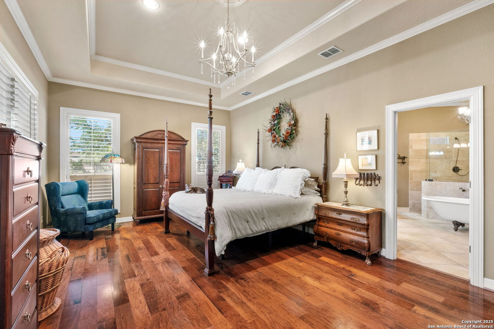 325 Whitestone Drive Spring Branch, TX 78070 - Photo 11 of 50 a spacious bedroom with a bed and a chandelier