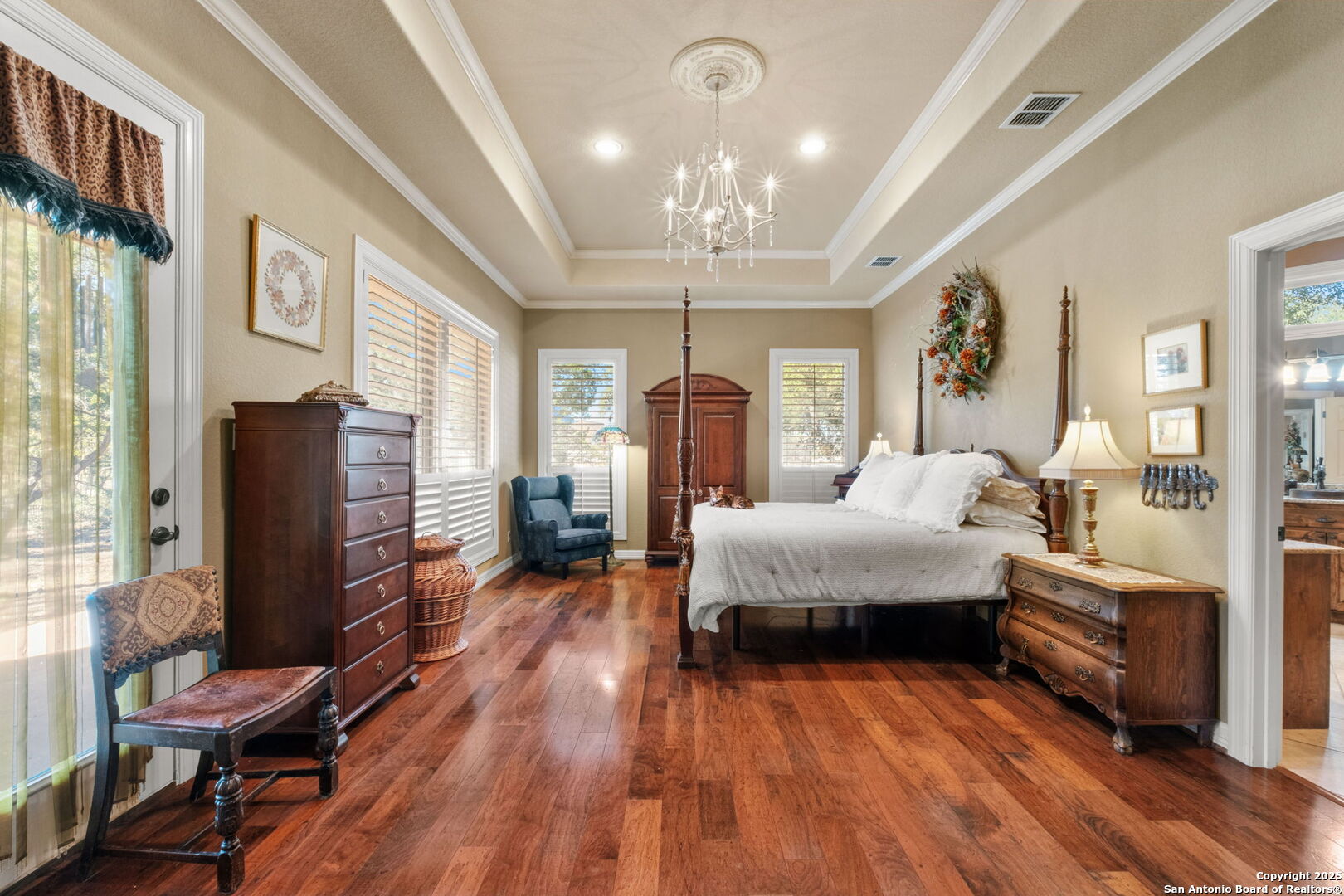 325 Whitestone Drive Spring Branch, TX 78070 - Photo 12 of 50 a spacious bedroom with a bed and wooden floor