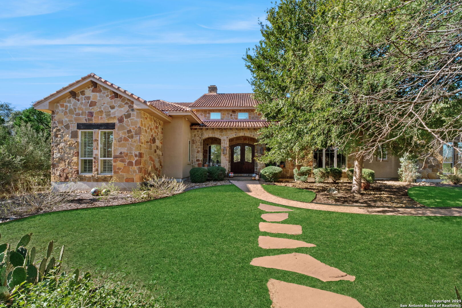 325 Whitestone Drive Spring Branch, TX 78070 - Photo 2 of 50 a front view of a house with a yard table and chairs