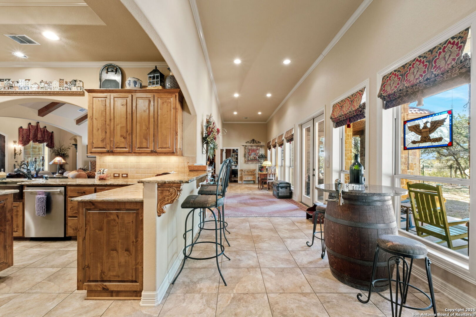 325 Whitestone Drive Spring Branch, TX 78070 - Photo 32 of 50 a living room with stainless steel appliances kitchen island granite countertop a table chairs and a view of living room